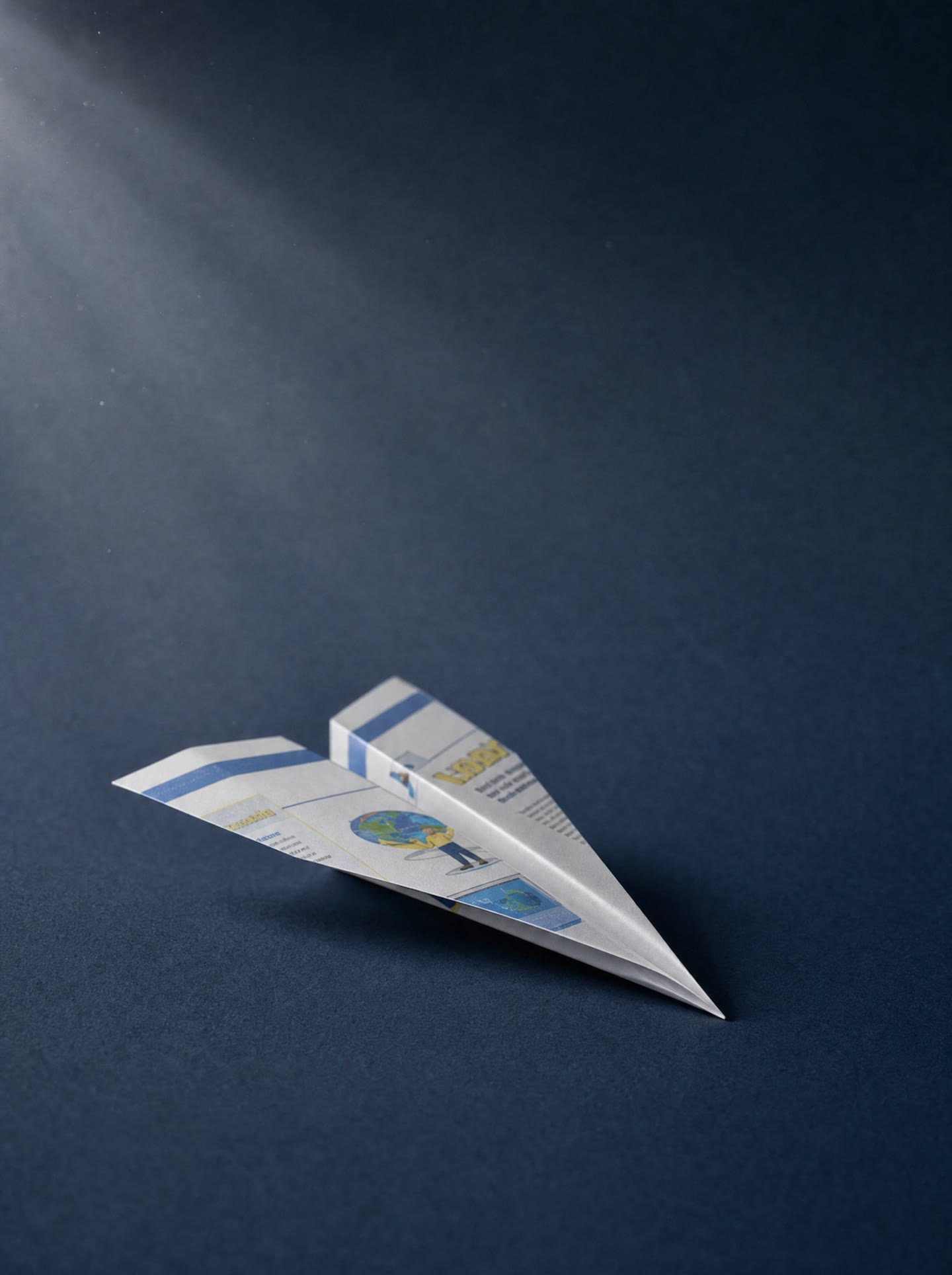 A paper aeroplane folded from a printout of an old website, ready to send